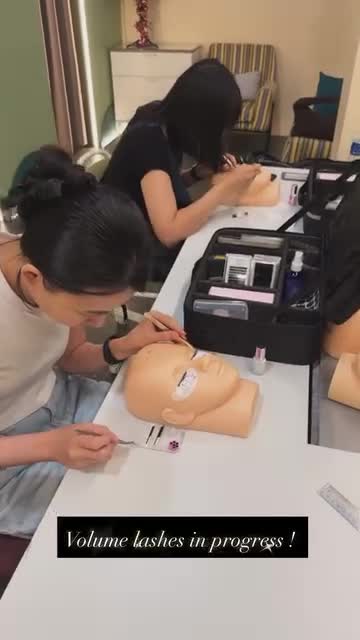 Hands-on eyelash extension practice during Jealash training