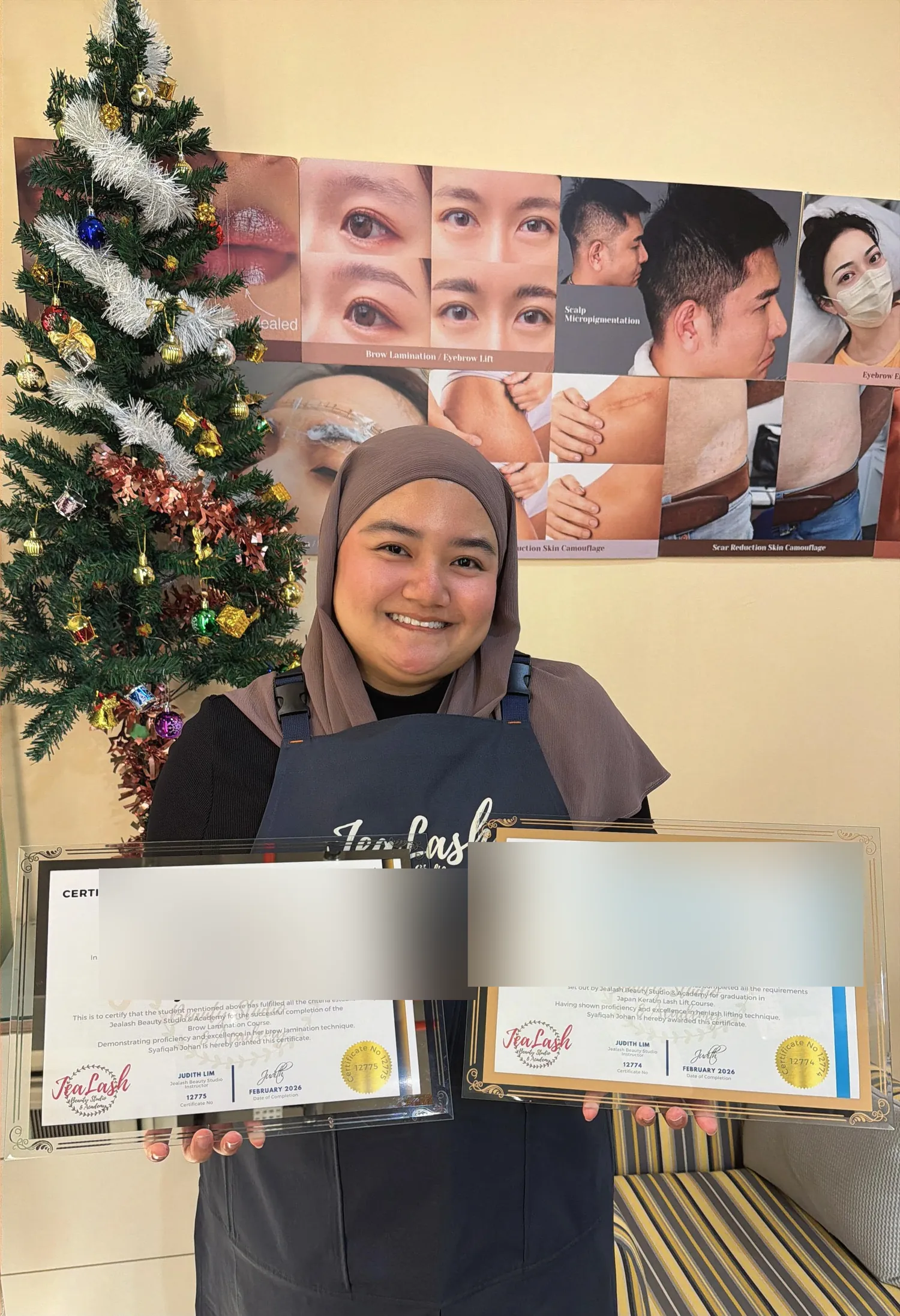 Jealash graduate holding Lash Lift and Brow Lamination certificates with the student name obscured for privacy