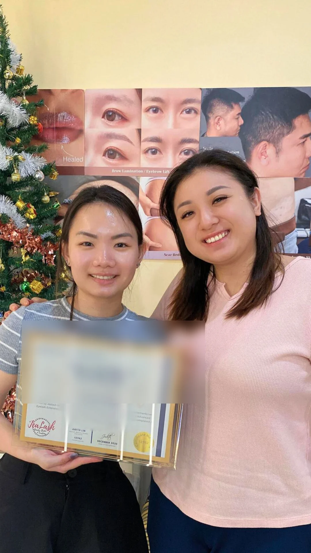 Jealash graduate holding a privacy-blurred course completion certificate