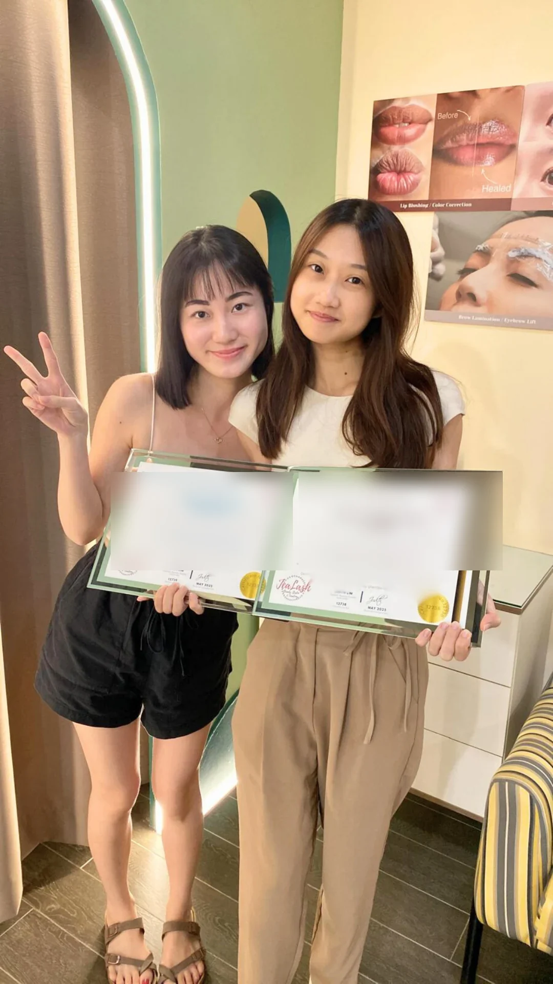 Jealash graduate holding a privacy-blurred course completion certificate