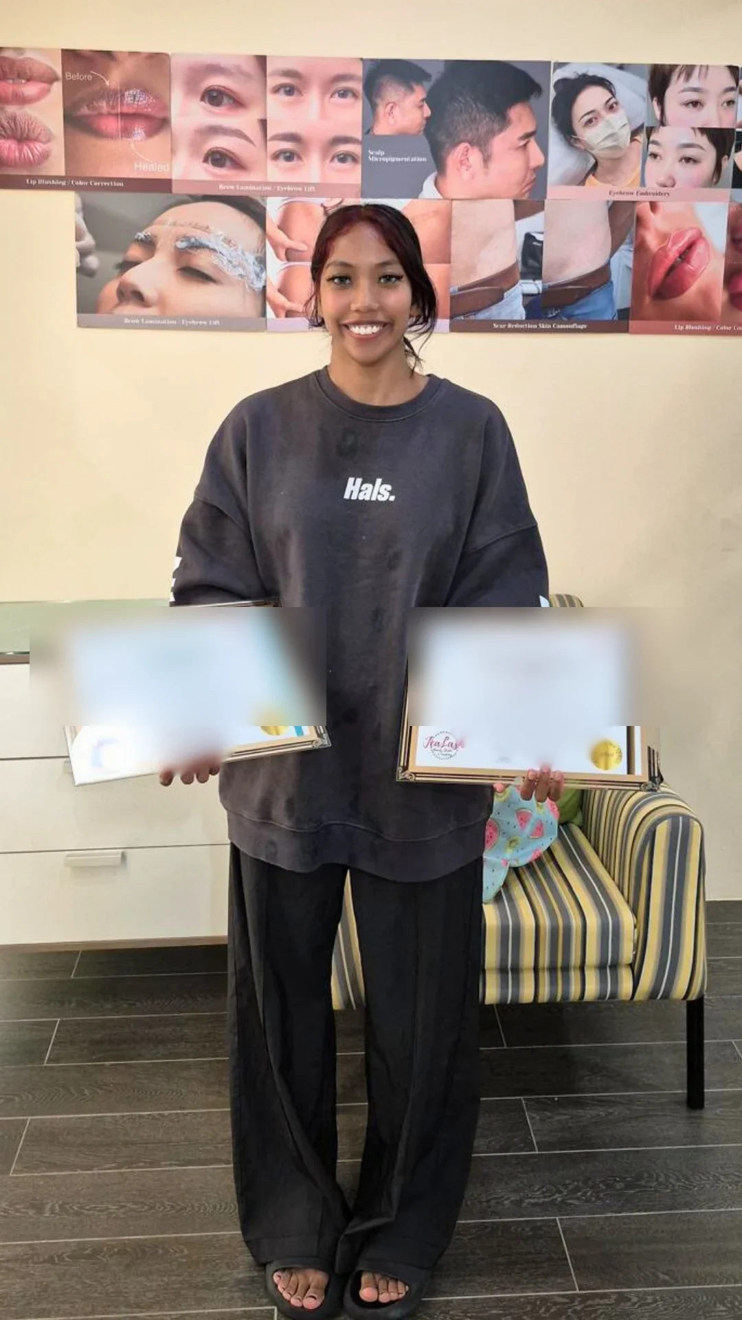 Jealash graduate holding a privacy-blurred course completion certificate