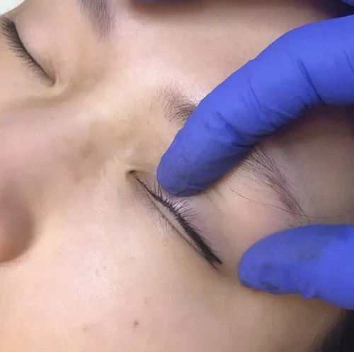 Eyeliner embroidery procedure close-up